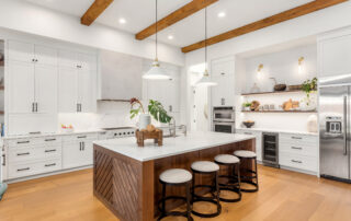 Cream-white painted kitchen cabinets with black hardware, white subway tile backsplash, and wood beam ceiling why do painted cabinets fail