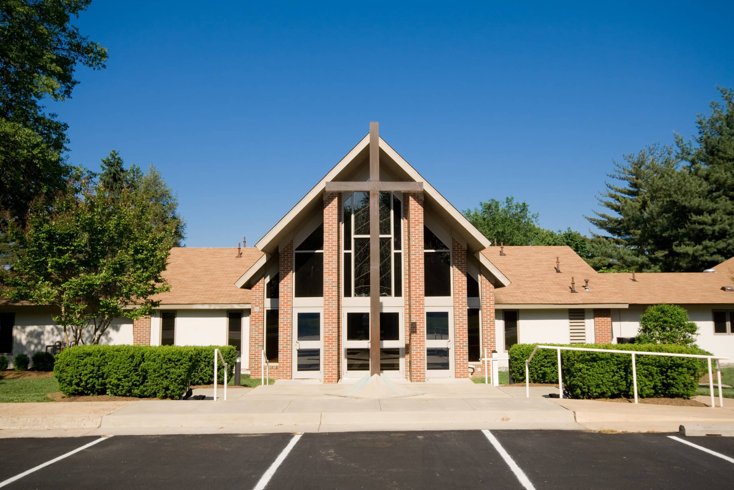 Exterior Modern Church A-Frame Gabled Roof, Metal Cross Exterior Modern Church A-Frame Gabled Roof, Metal Cross